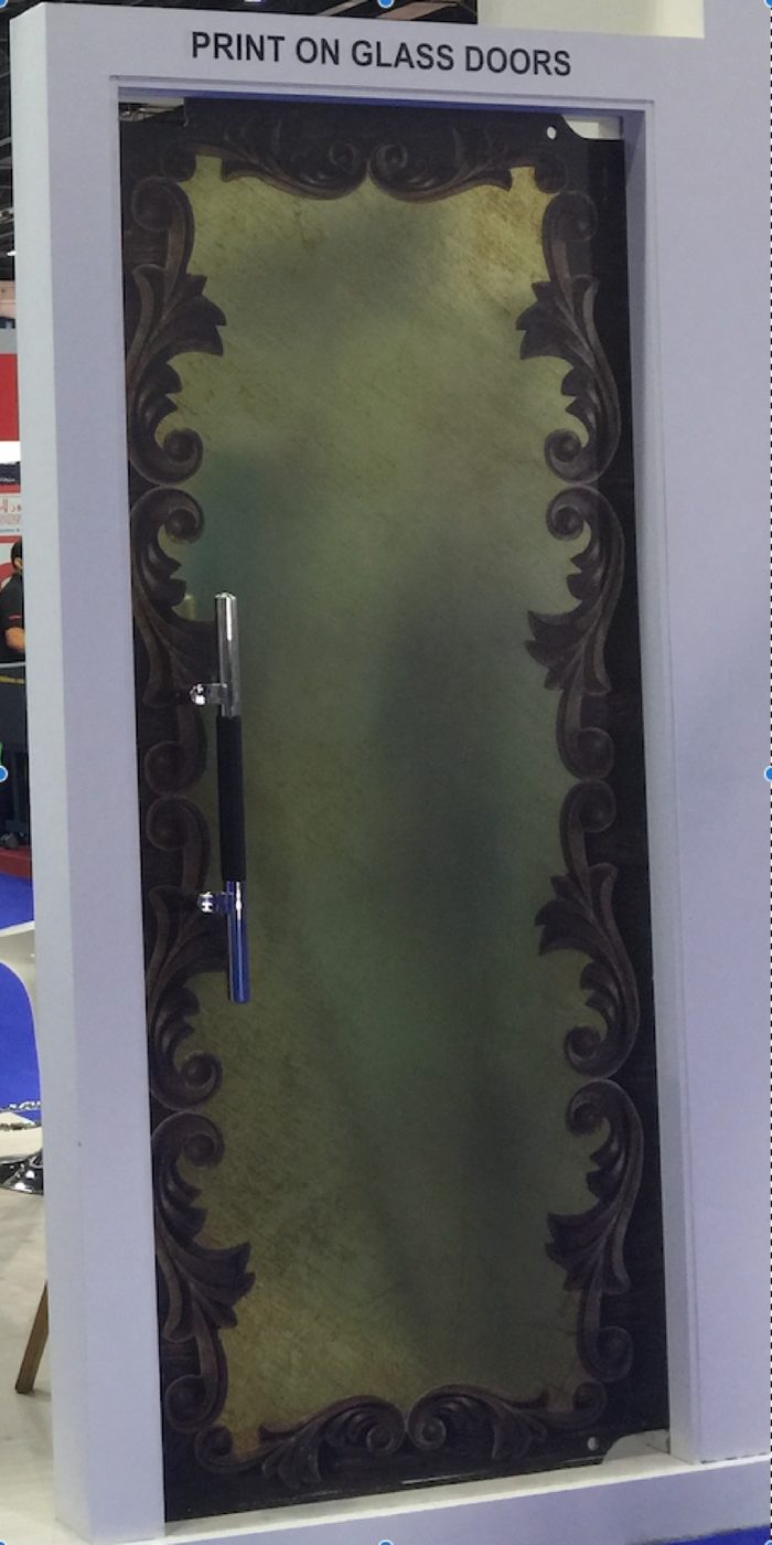 A glass door printed edge to edge with an ornamental design