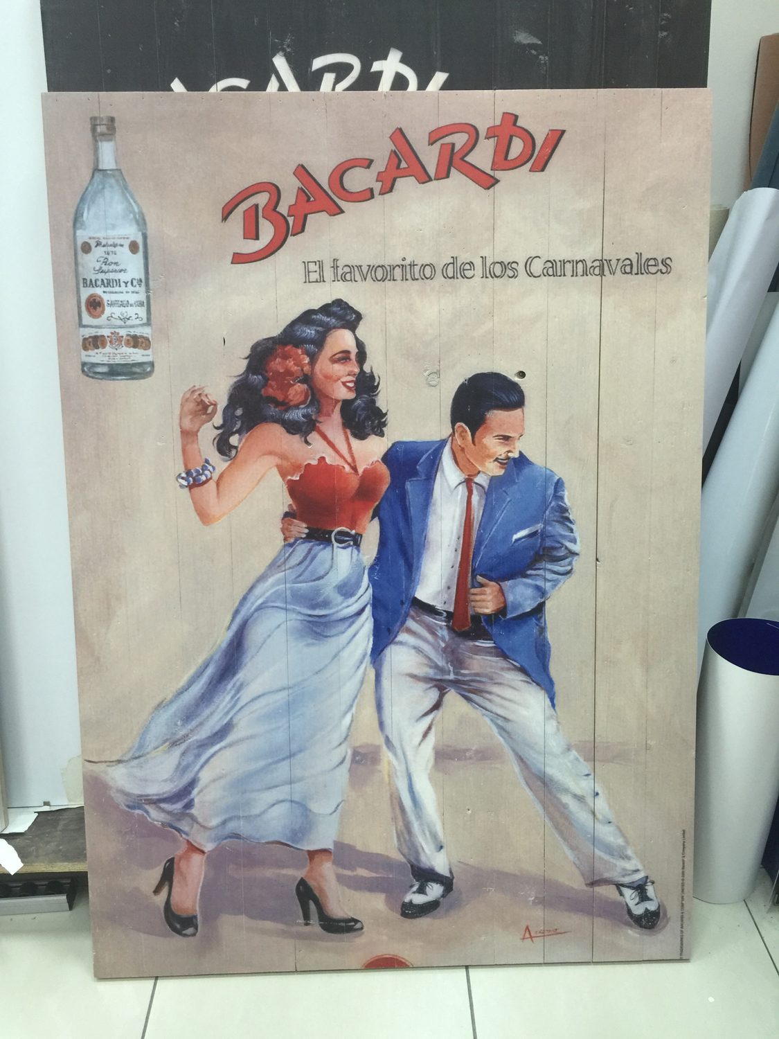 A timber panel printed with artwork, the board joints and grain still reading through the ink