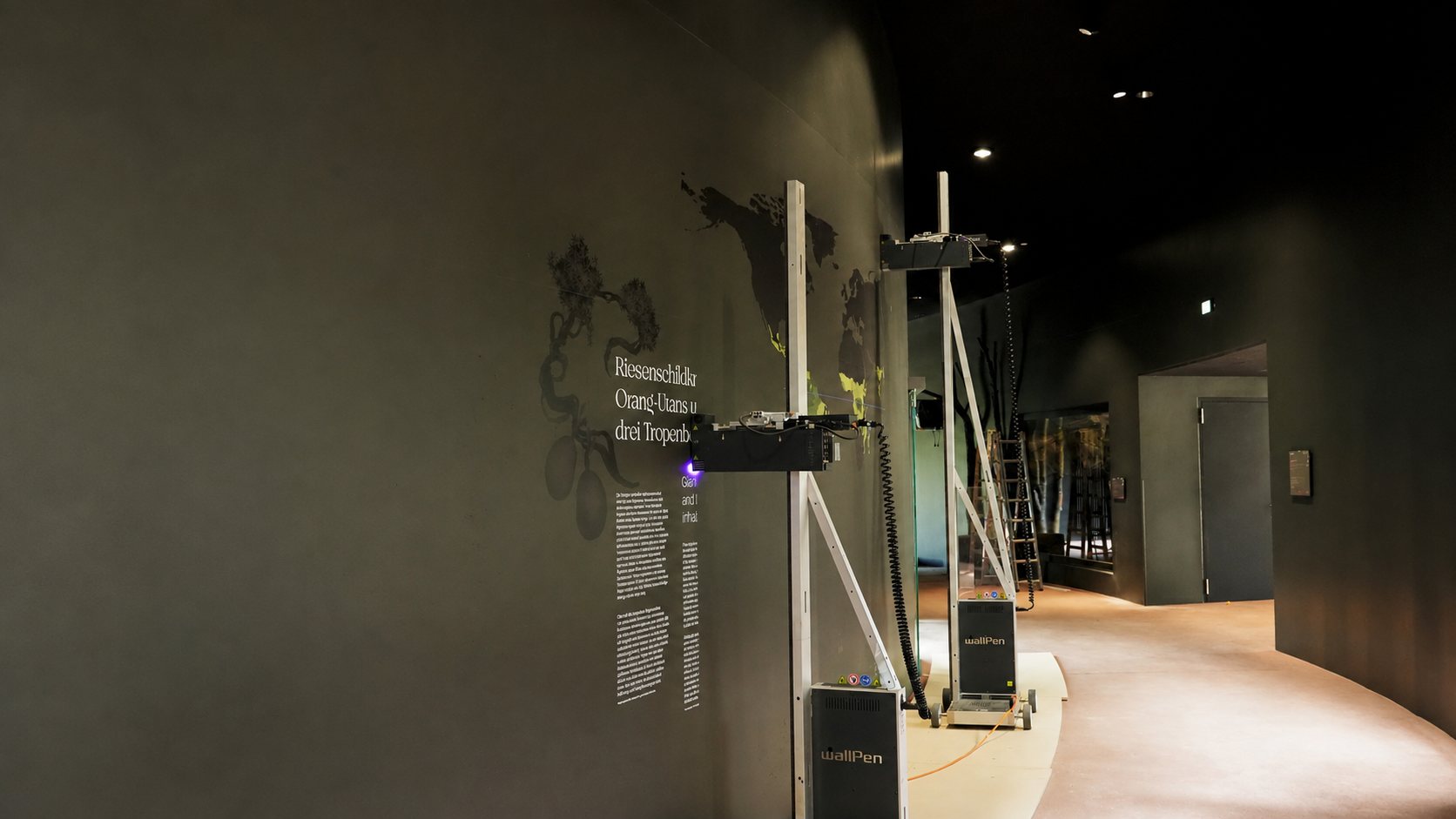 A wallPen printing a mural directly onto a museum wall on site, direct to wall UV printing in Dubai and the GCC